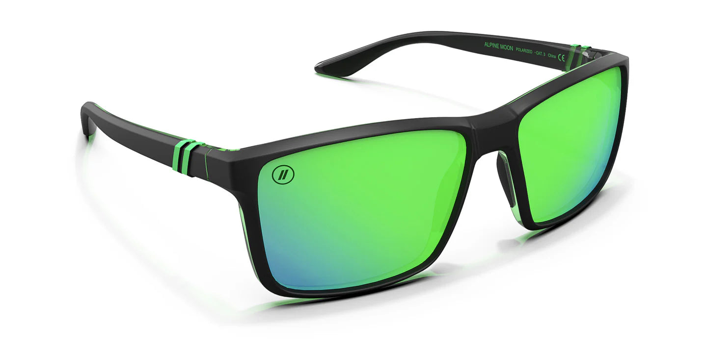 A close up, angled front view of the Alpine Moon Blenders Sunglasses showcasing the inside and outside of the matte rubberized black and gloss green frame and polarized green mirrored lenses of the sunglasses.