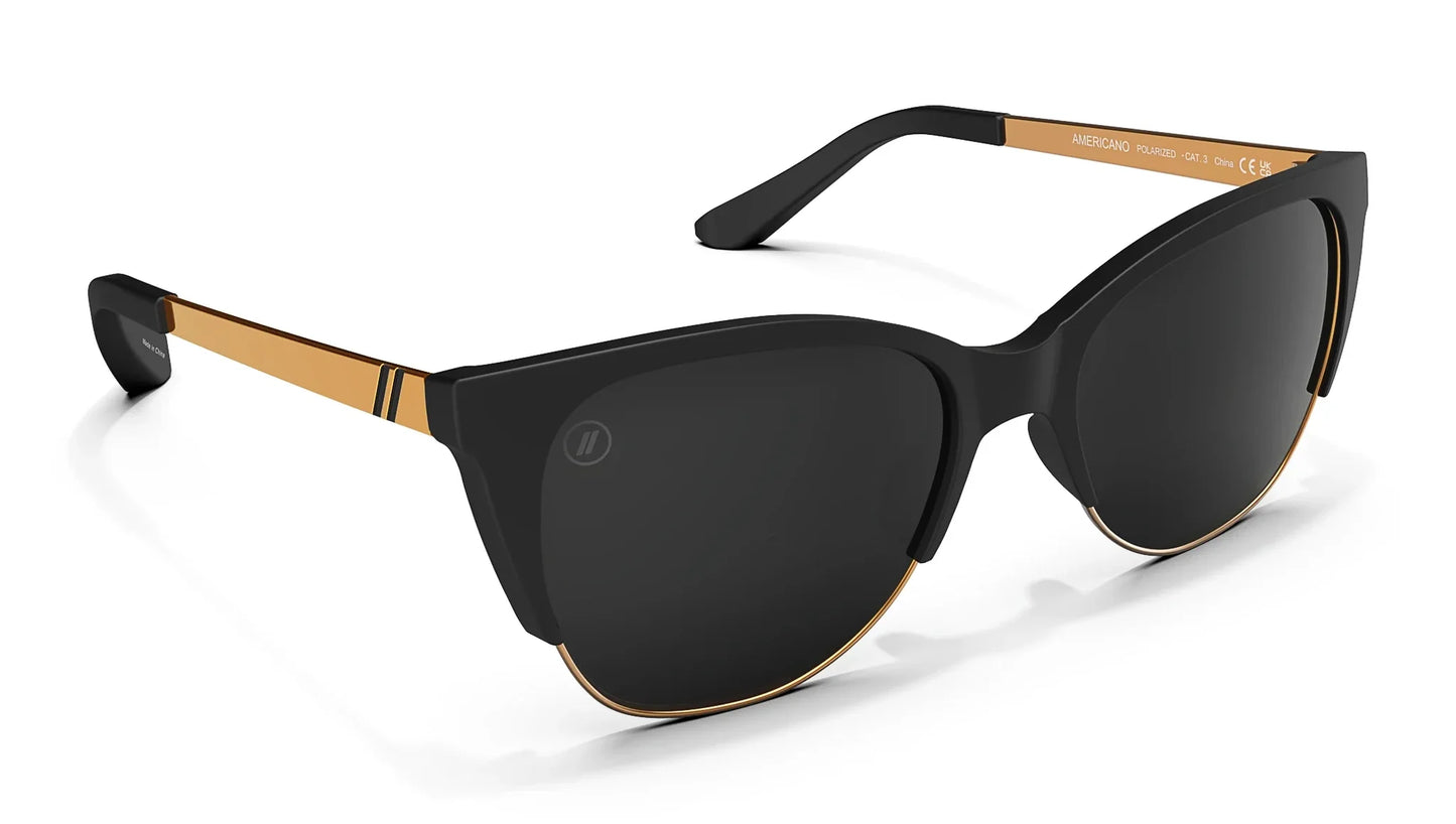 A close up, angled view of the front and right side of the Americano Blenders Sunglasses showcasing the matte black rubberized frame and polarized smoke lenses of the sunglasses.