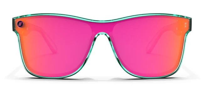 A close up, front view of the Dance Electric Blenders Sunglasses showcasing the gloss crystal teal frame and polarized hot pink mirrored lenses of the sunglasses.