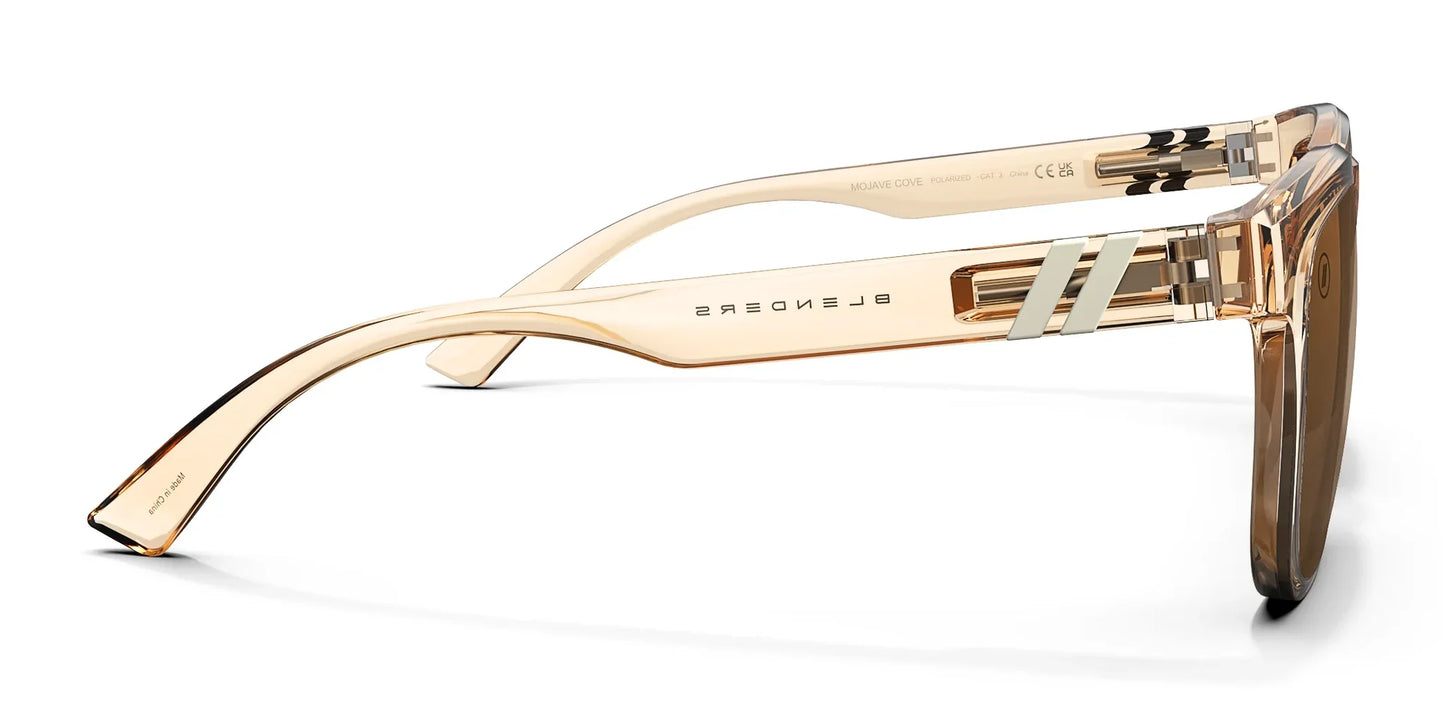 A close up, right side view of the Mojave Cove Blenders Sunglasses showcasing the inside and outside of the crystal tan frame and PureBlend™ amber lenses of the sunglasses.