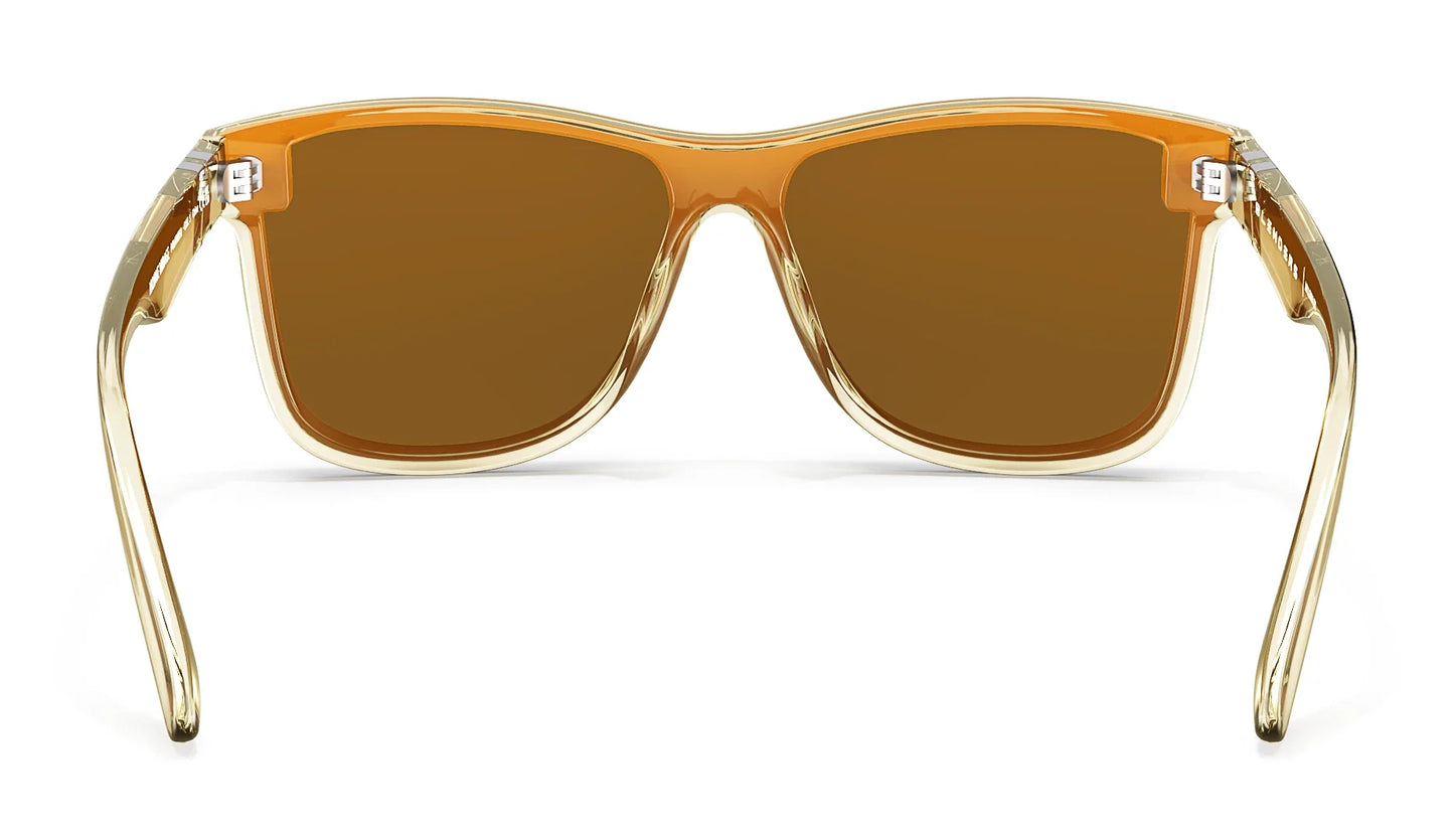 A close up, back view of the Mojave Mirage Blenders Sunglasses showcasing the inner side of the gloss crystal tan frames and polarized amber lenses of the sunglasses.