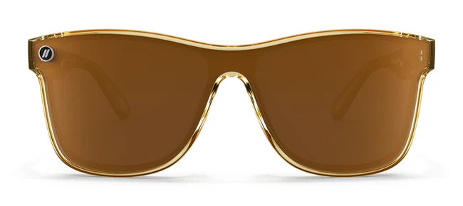 A close up, front view of the Mojave Mirage Blenders Sunglasses showcasing the gloss crystal tan frames and polarized amber lenses of the sunglasses.