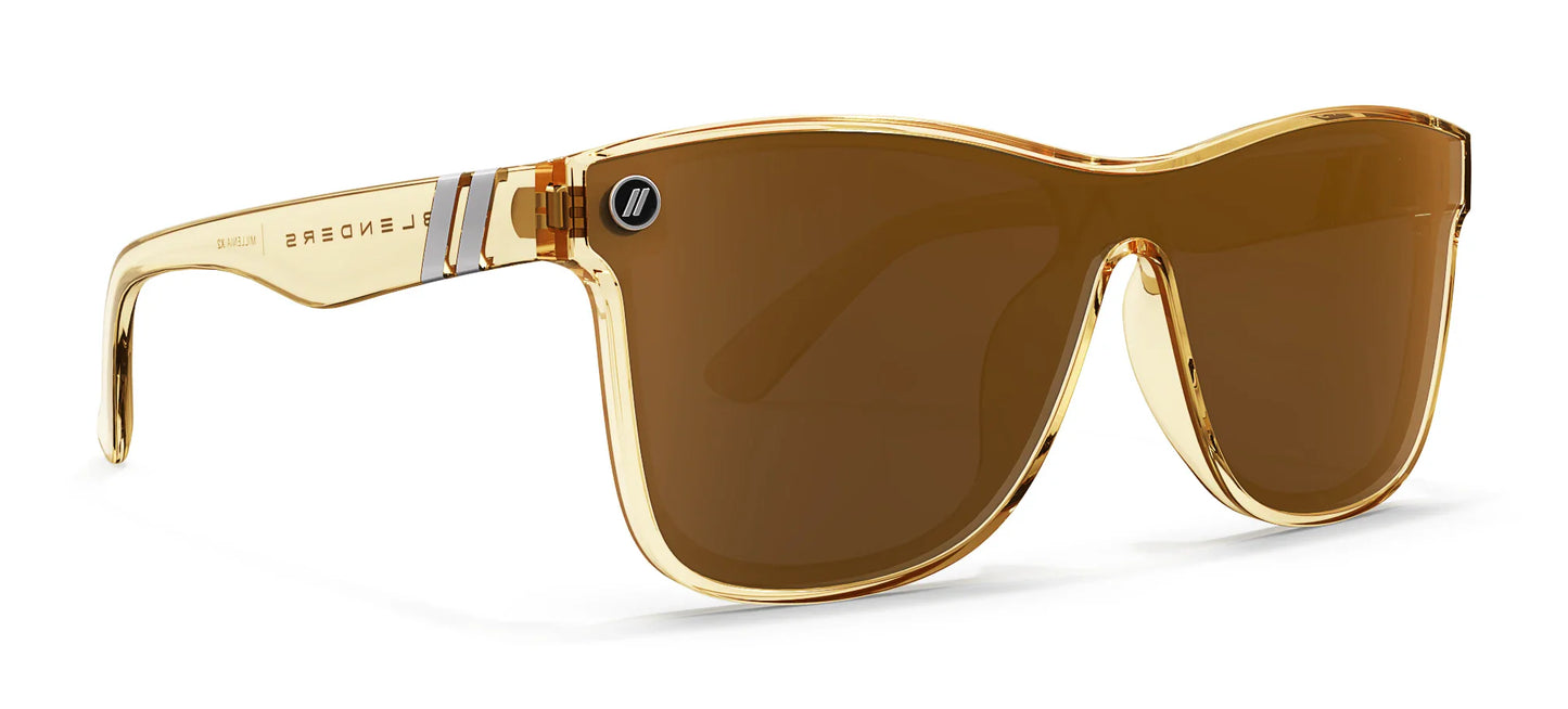 A close up, angled view of the front and right side of the Mojave Mirage Blenders Sunglasses showcasing the gloss crystal tan frames and polarized amber lenses of the sunglasses.