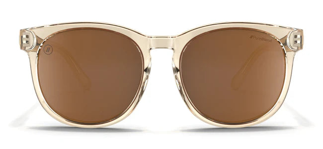 A close up, front view of the Mojave Moon Blenders Sunglasses showcasing the crystal tan frame and PureBlend™ amber lenses of the sunglasses.