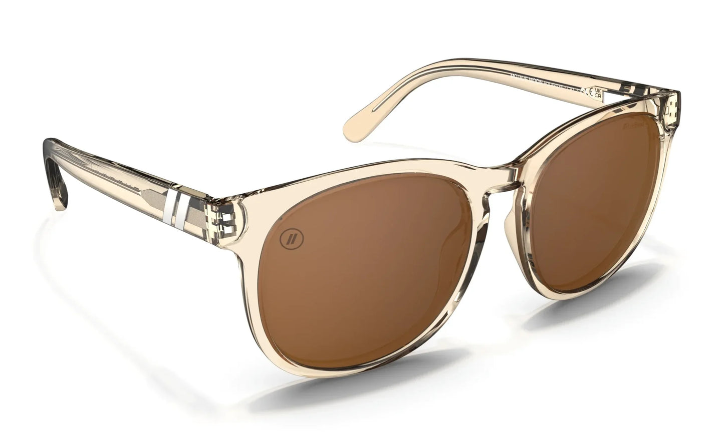 A close up, angled front view of the Mojave Moon Blenders Sunglasses showcasing the inside and outside of the crystal tan frame and PureBlend™ amber lenses of the sunglasses.