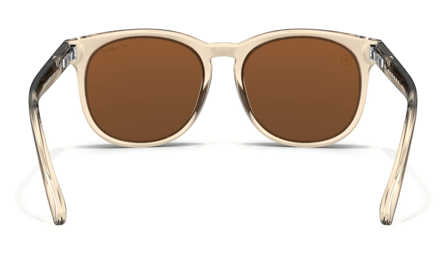 A close up, back view of the Mojave Moon Blenders Sunglasses showcasing the inner sides of the crystal tan frame and PureBlend™ amber lenses of the sunglasses.