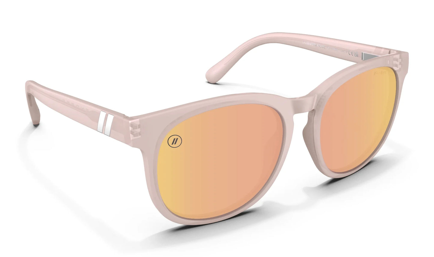 A close up, angled front view of the Pink Rose Blenders Sunglasses showcasing the inside and outside of the glossed milky pink frame and polarized PureBlend™ pink mirrored lenses of the sunglasses.