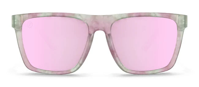 A close up, front view of the Pretty Gangsta Blenders Sunglasses showcasing the gloss crystal clear gray and pink tortoise frame and polarized pink mirrored lenses of the sunglasses.