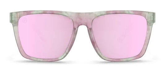 A close up, front view of the Pretty Gangsta Blenders Sunglasses showcasing the gloss crystal clear gray and pink tortoise frame and polarized pink mirrored lenses of the sunglasses.