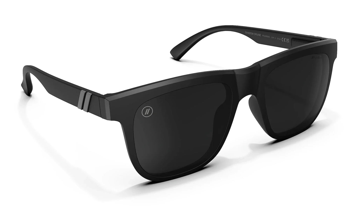 A close up, angled front view of the Shadow Cruise Blenders Sunglasses showcasing the inside and outside of the glossy black frame and PureBlend™ smoke black lenses of the sunglasses.