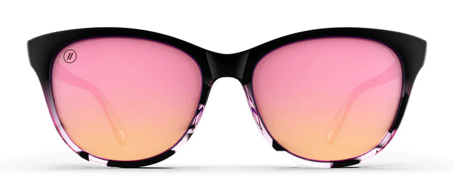 A close up, front view of the Sweet Tonic Blenders Sunglasses showcasing the glossy black and pink tortoise frame and polarized pink mirrored lenses of the sunglasses.