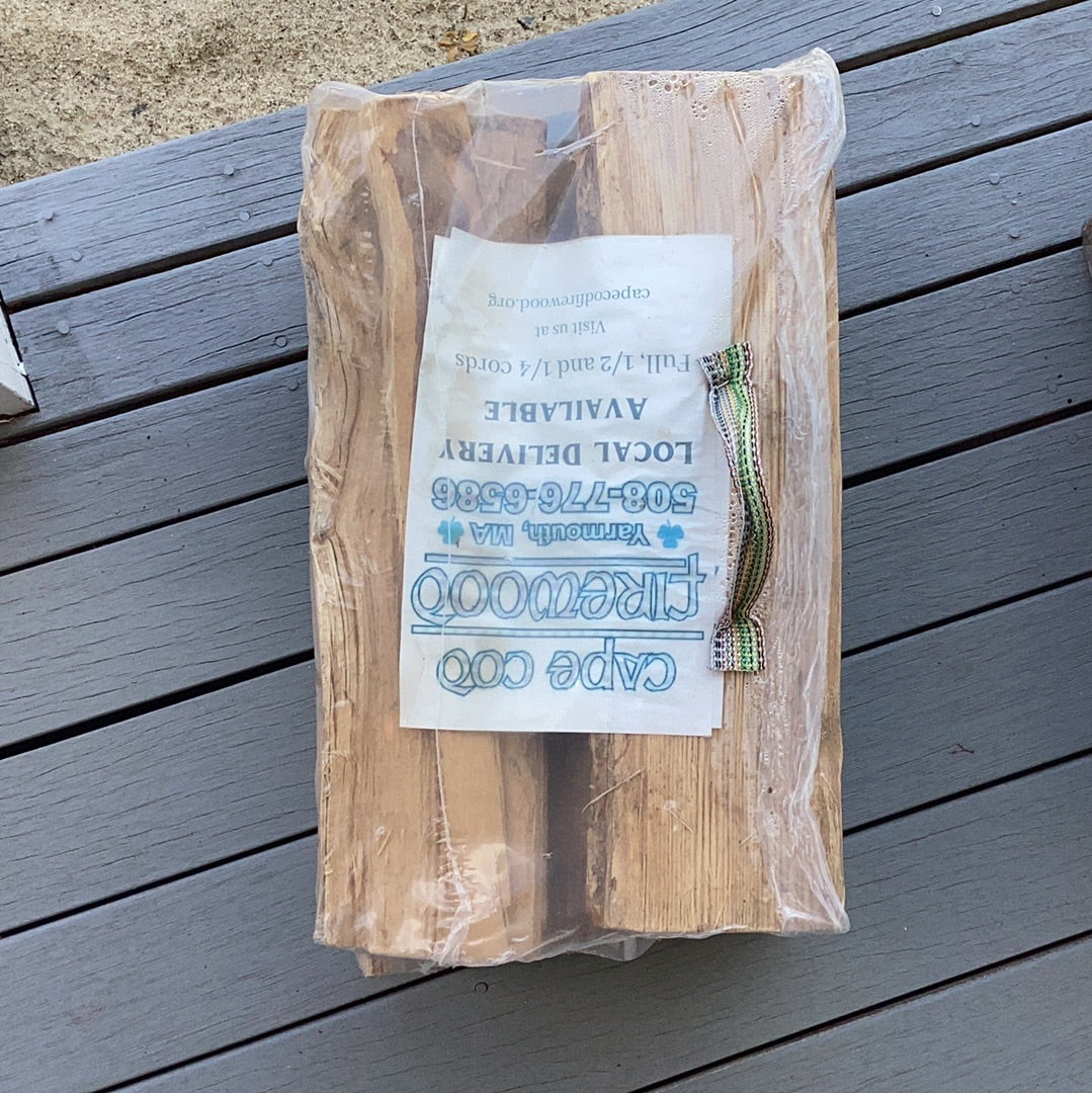 Plastic Wrapped Firewood on white background