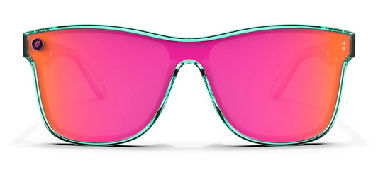 A close up, front view of the Dance Electric Blenders Sunglasses showcasing the gloss crystal teal frame and polarized hot pink mirrored lenses of the sunglasses.