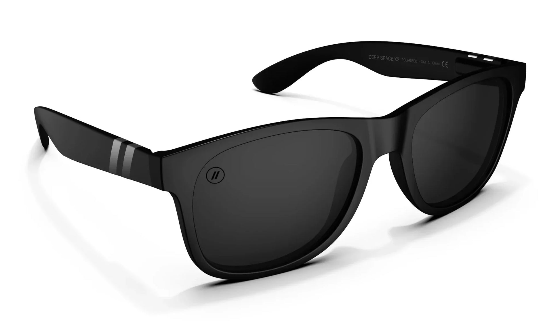 A close up, angled front view of the Deep Space X2 Blenders Sunglasses showcasing the inside and outside of the matte black frame and polarized smoke lenses of the sunglasses.
