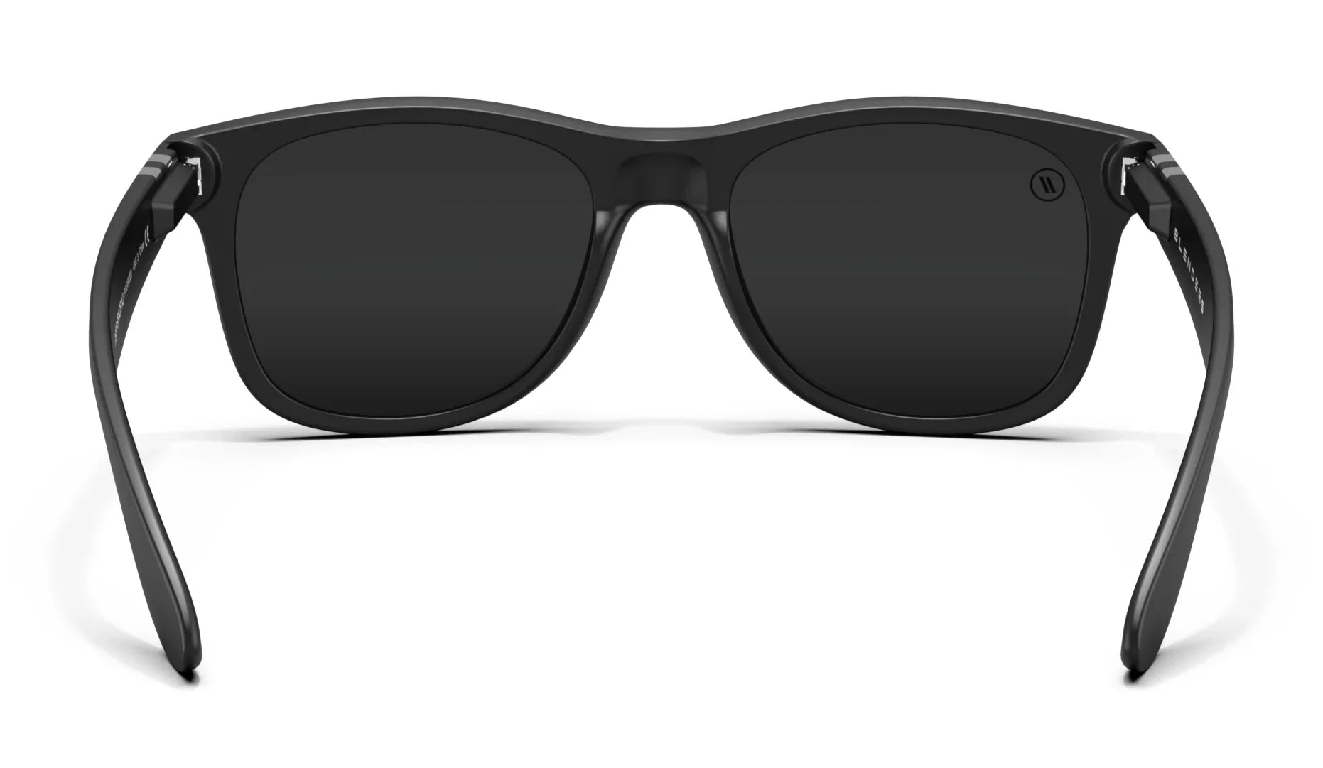 A close up, back view of the Sterling Deep Space X2 Sunglasses showcasing the inner sides of the matte black frame and polarized smoke lenses of the sunglasses.