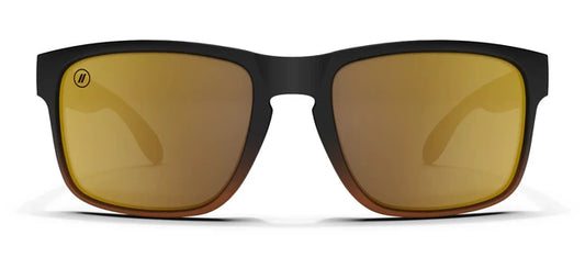 A close up, front view of the Gold Punch Blenders Sunglasses showcasing the matte black to crystal tan fade frame and polarized copper lenses of the sunglasses.