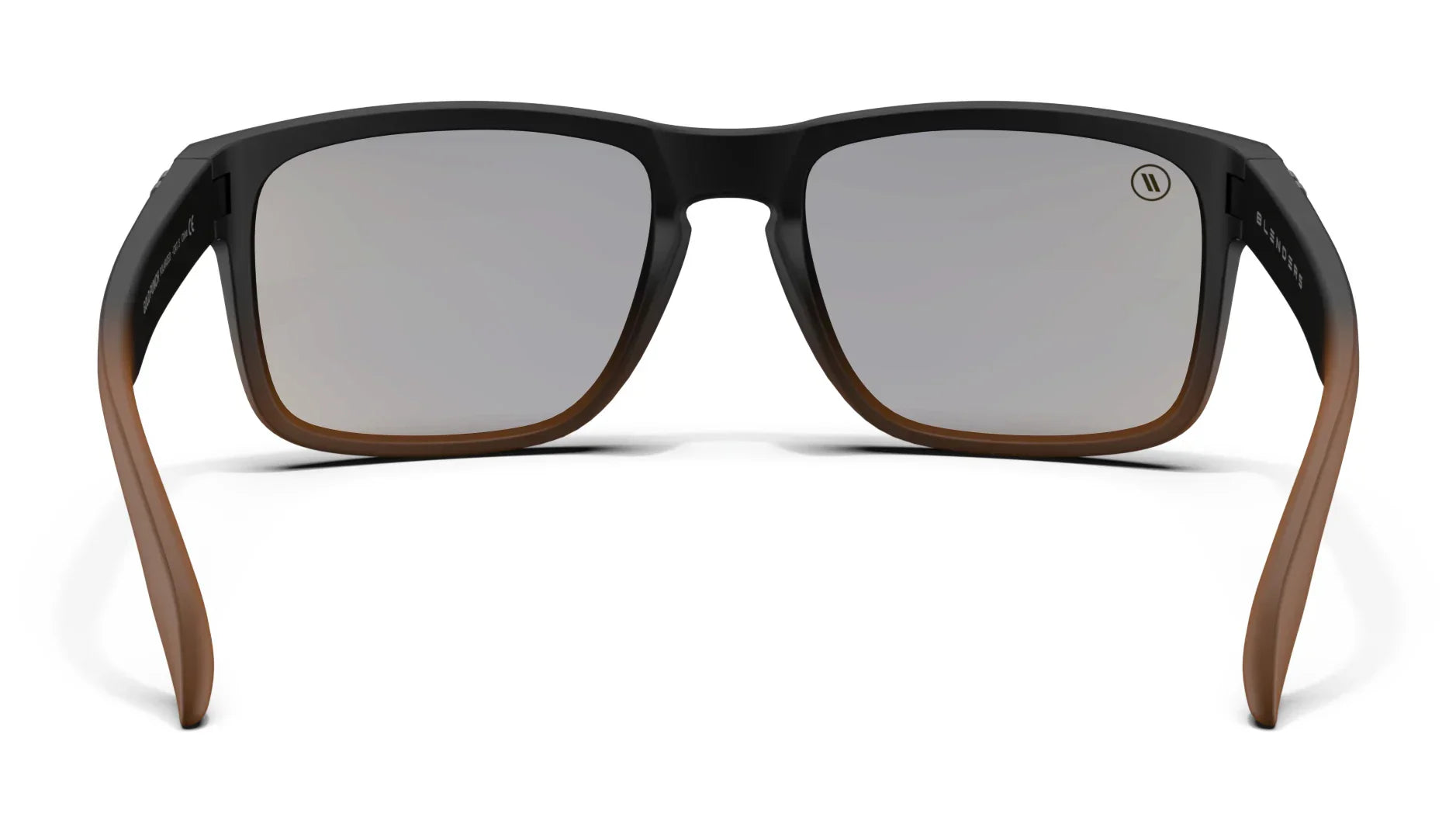 A close up, back view of the Gold Punch Blenders Sunglasses showcasing the inner sides of the matte black to crystal tan fade frame and polarized copper lenses of the sunglasses.