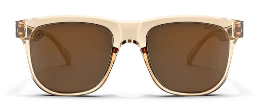 A close up, front view of the Mojave Cove Blenders Sunglasses showcasing the crystal tan frame and PureBlend™ amber lenses of the sunglasses.
