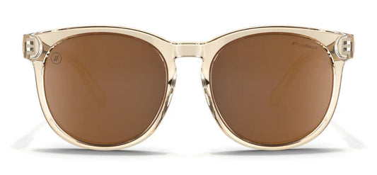 A close up, front view of the Mojave Moon Blenders Sunglasses showcasing the crystal tan frame and PureBlend™ amber lenses of the sunglasses.