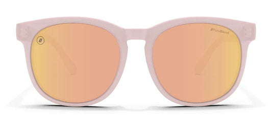 A close up, front view of the Pink Rose Blenders Sunglasses showcasing the gloss milky pink frame and polarized PureBlend™ pink mirror lenses of the sunglasses.