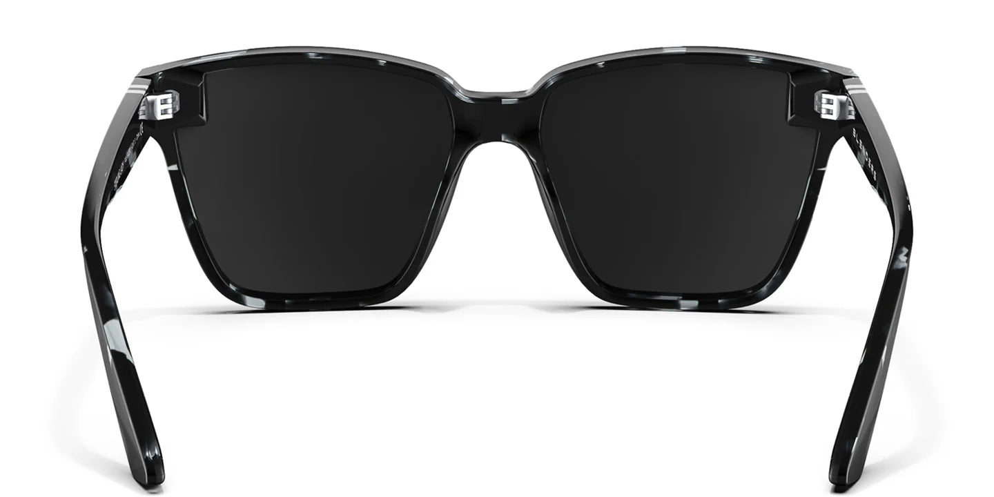 A close up, back view of the Sterling Lady Blenders Sunglasses showcasing the inner sides of the crystal gray and solid black tortoise pattern frames and polarized silver mirrored lenses of the sunglasses. 