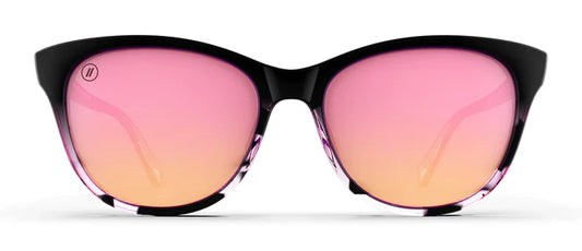 A close up, front view of the Sweet Tonic Blenders Sunglasses showcasing the glossy black and pink tortoise frame and polarized pink mirrored lenses of the sunglasses.