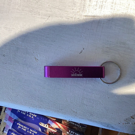 SNP Bottle Opener Keychain on white background